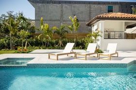 backyard patio outdoor seating pool landscape beds artificial turf 7