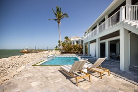 sea wall outdoor seating pool patio 