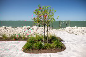 sea wall paver patio landscape bed