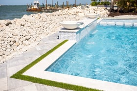 sea wall pool artificial turf patio